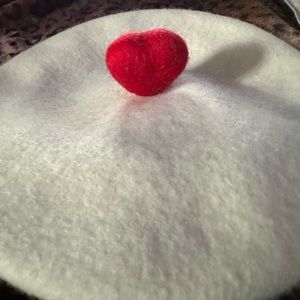 White beret with red heart